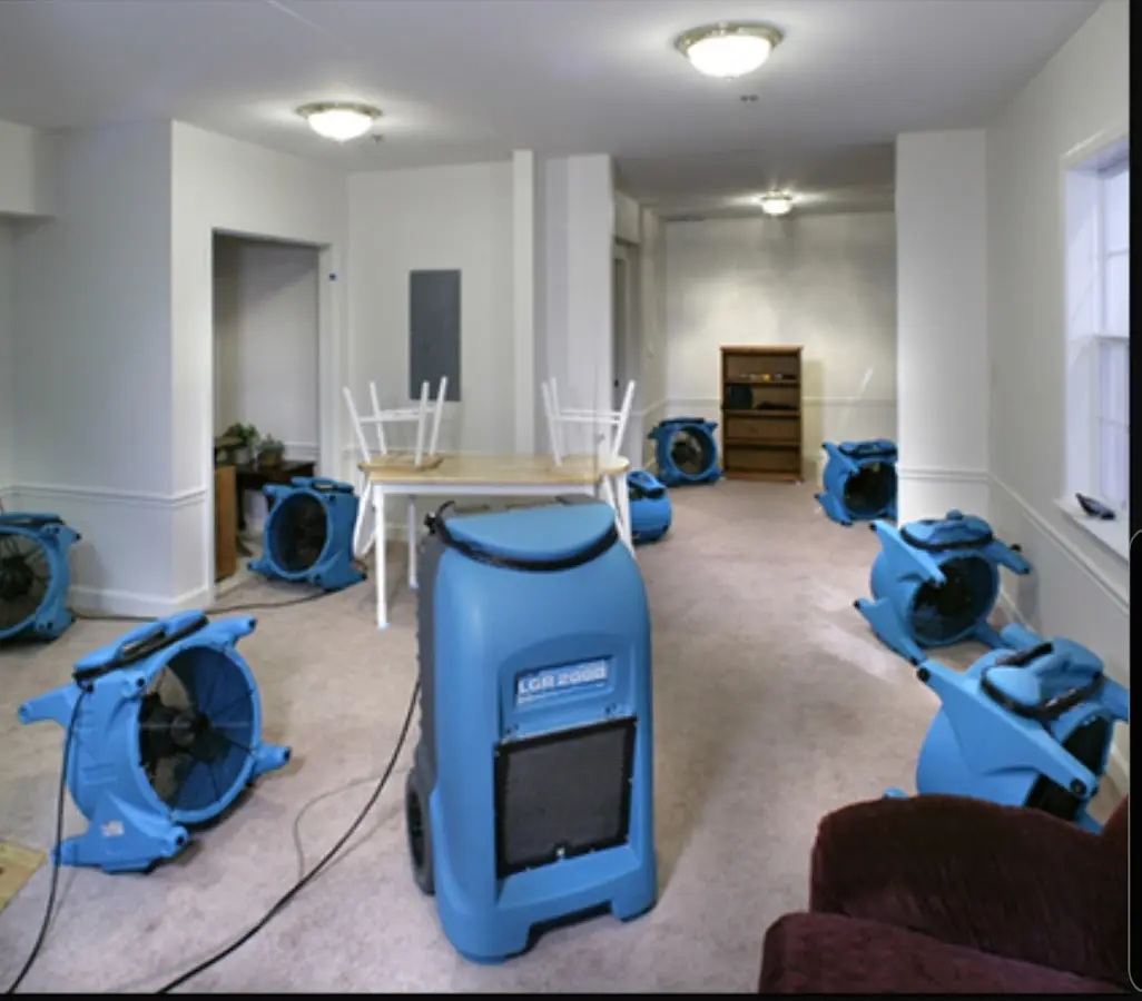 Air movers and dehumidifier setup for Water Damage Restoration in Penn